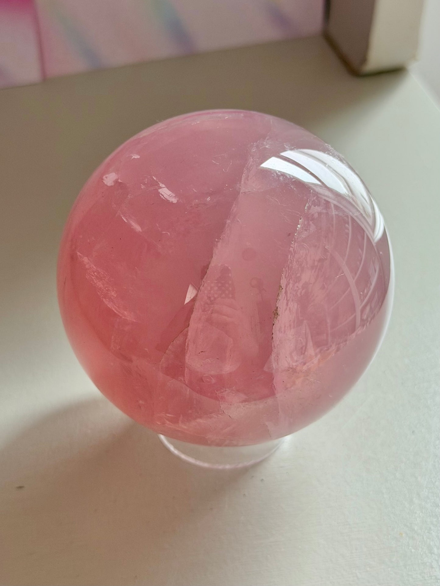 Gemmy purple-pink toned star rose quartz sphere