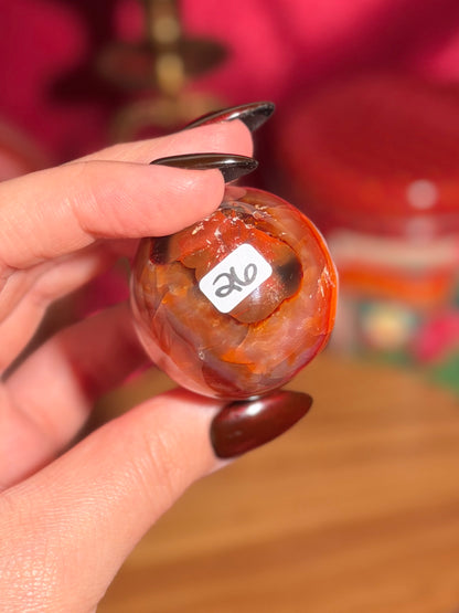 Peachy pink carnelian sphere