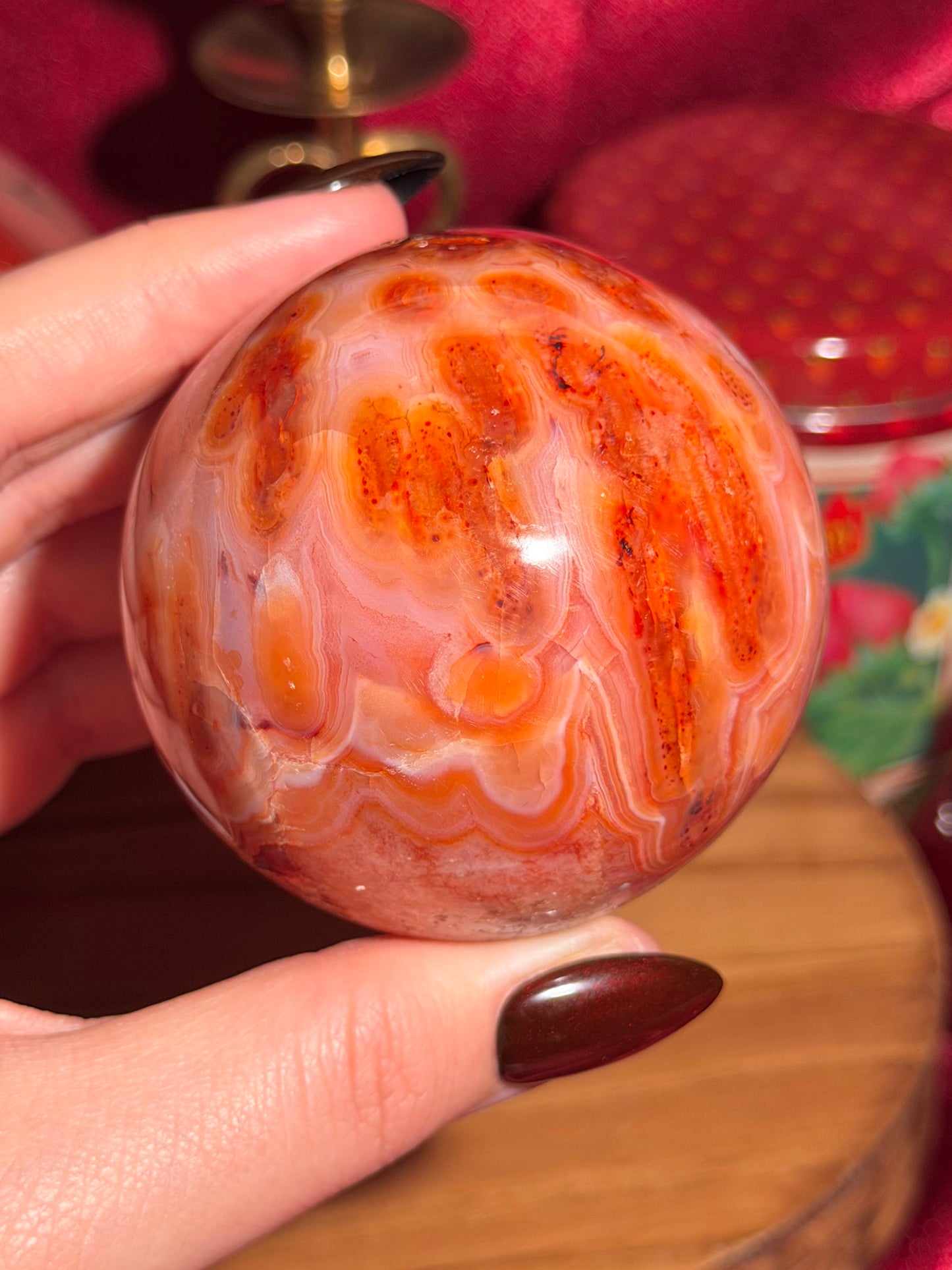 Mossy carnelian sphere with quartz cave