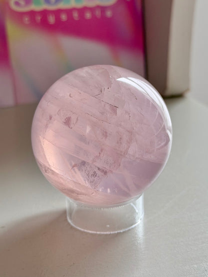 Pale pink gemmy star rose quartz sphere