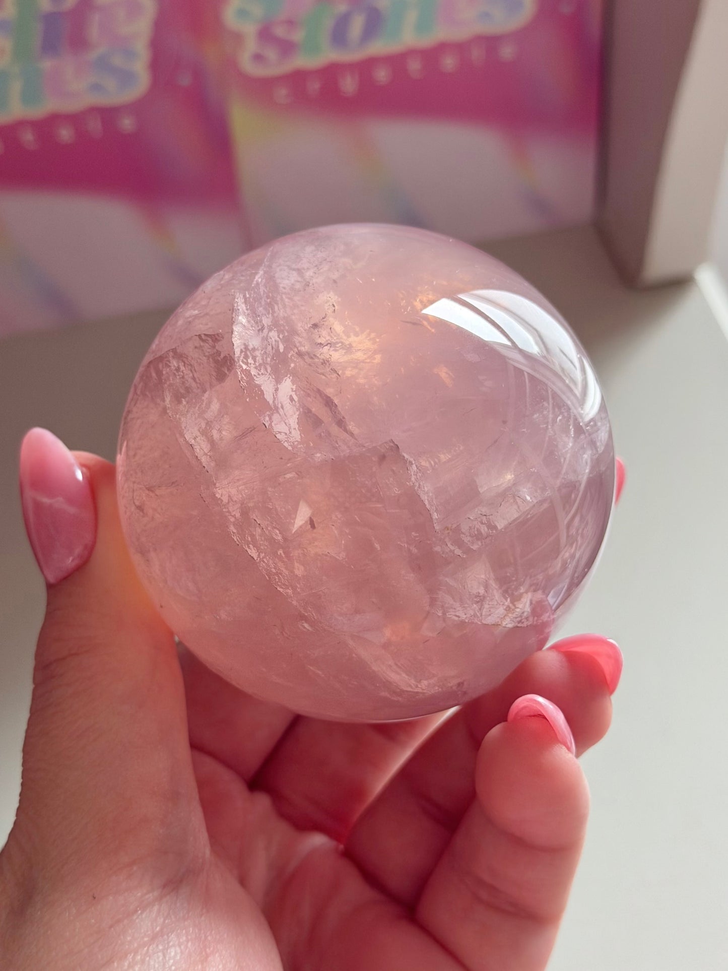 Gemmy purple-pink toned star rose quartz sphere