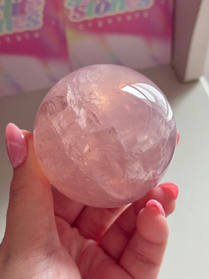 Gemmy purple-pink toned star rose quartz sphere