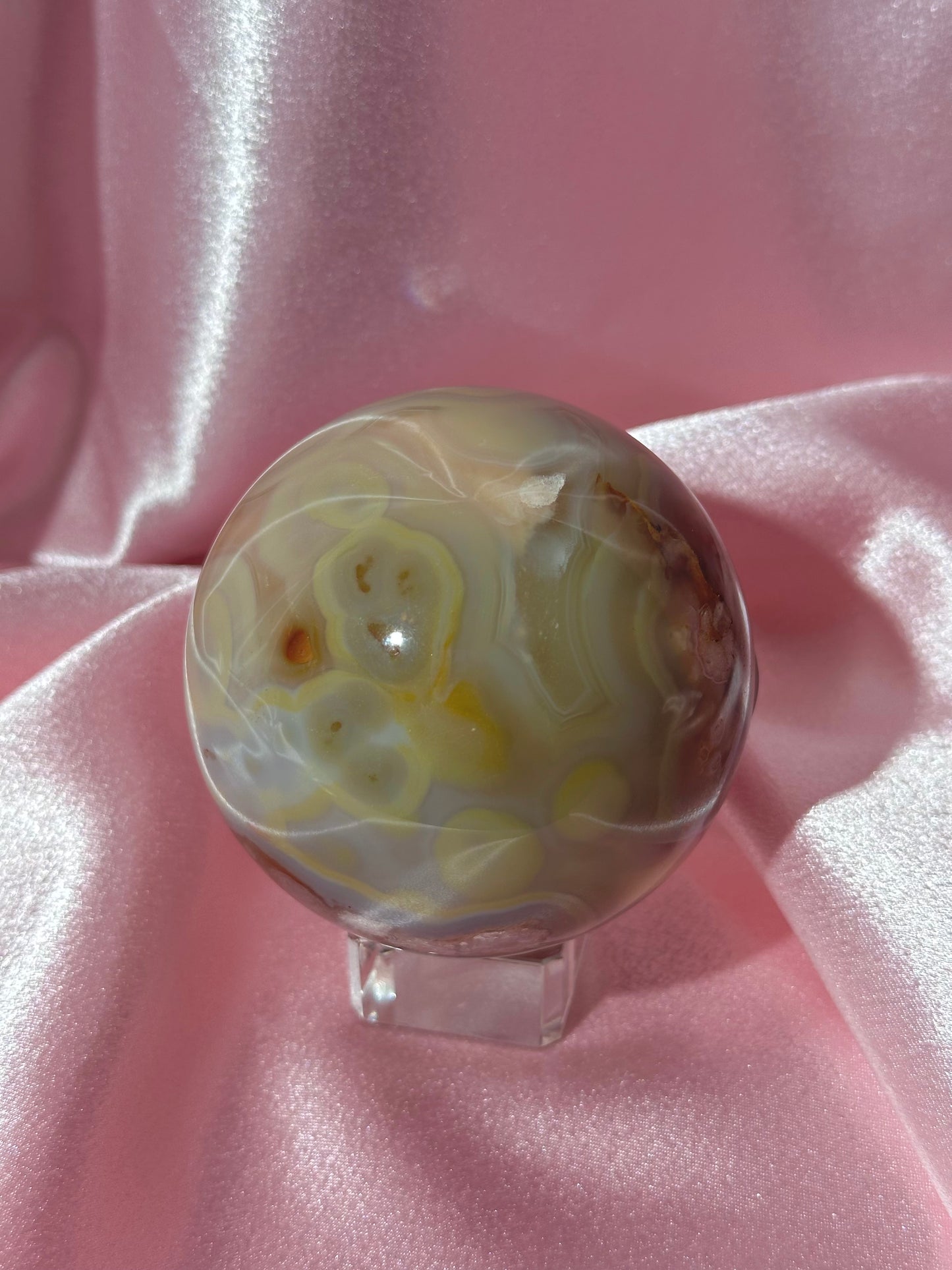 Perfect pastel peachy yellow & blue flower agate sphere from Madagascar
