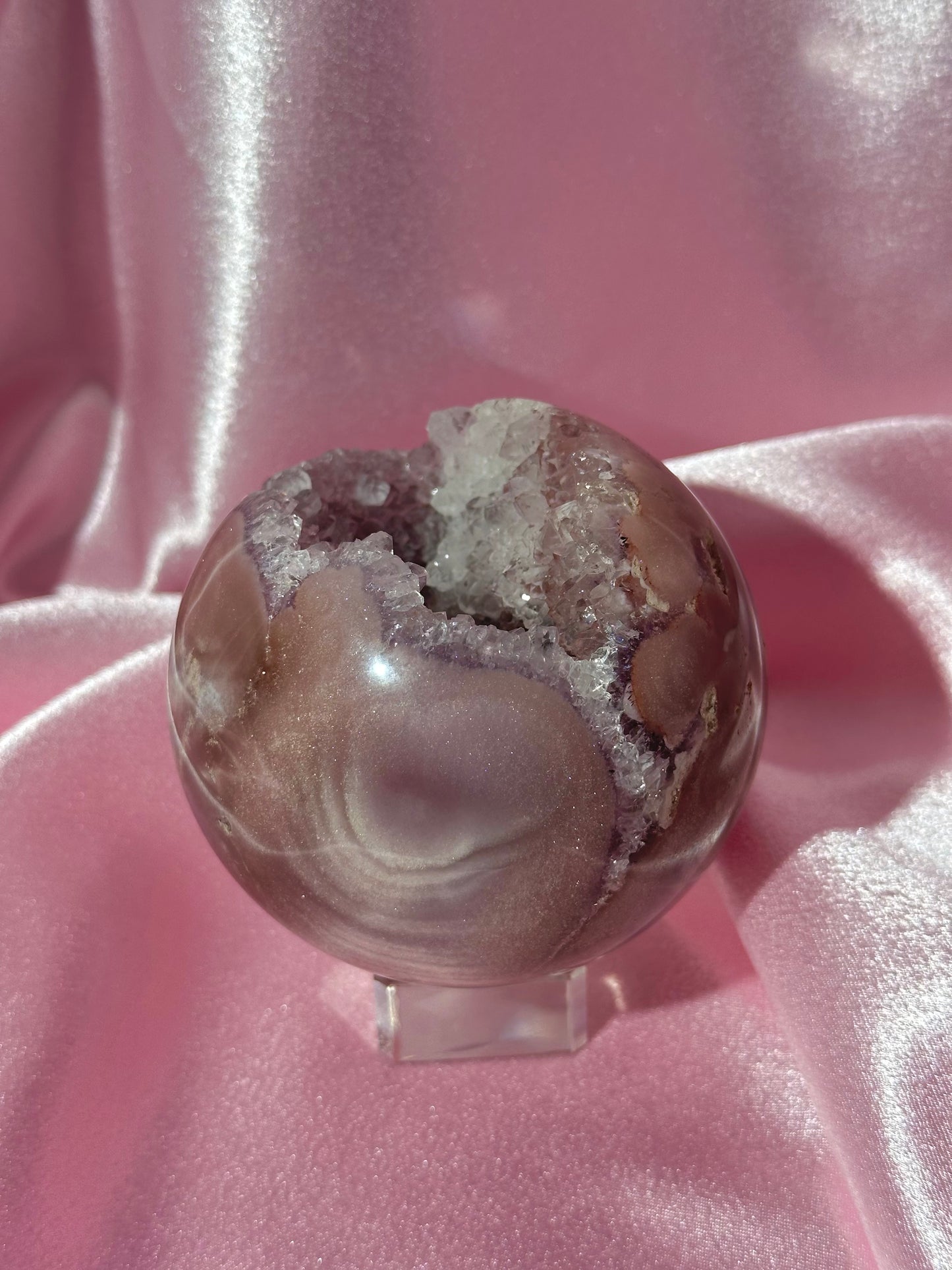 Lavender-toned glittery Brazilian pink amethyst sphere with stunning quartz cave
