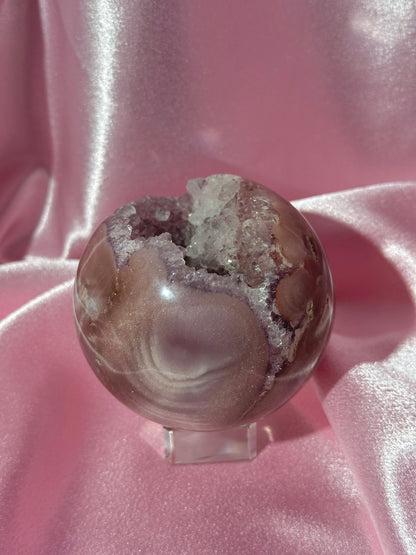 Lavender-toned glittery Brazilian pink amethyst sphere with stunning quartz cave