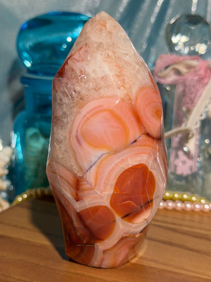 Large pink banded carnelian flame with quartz