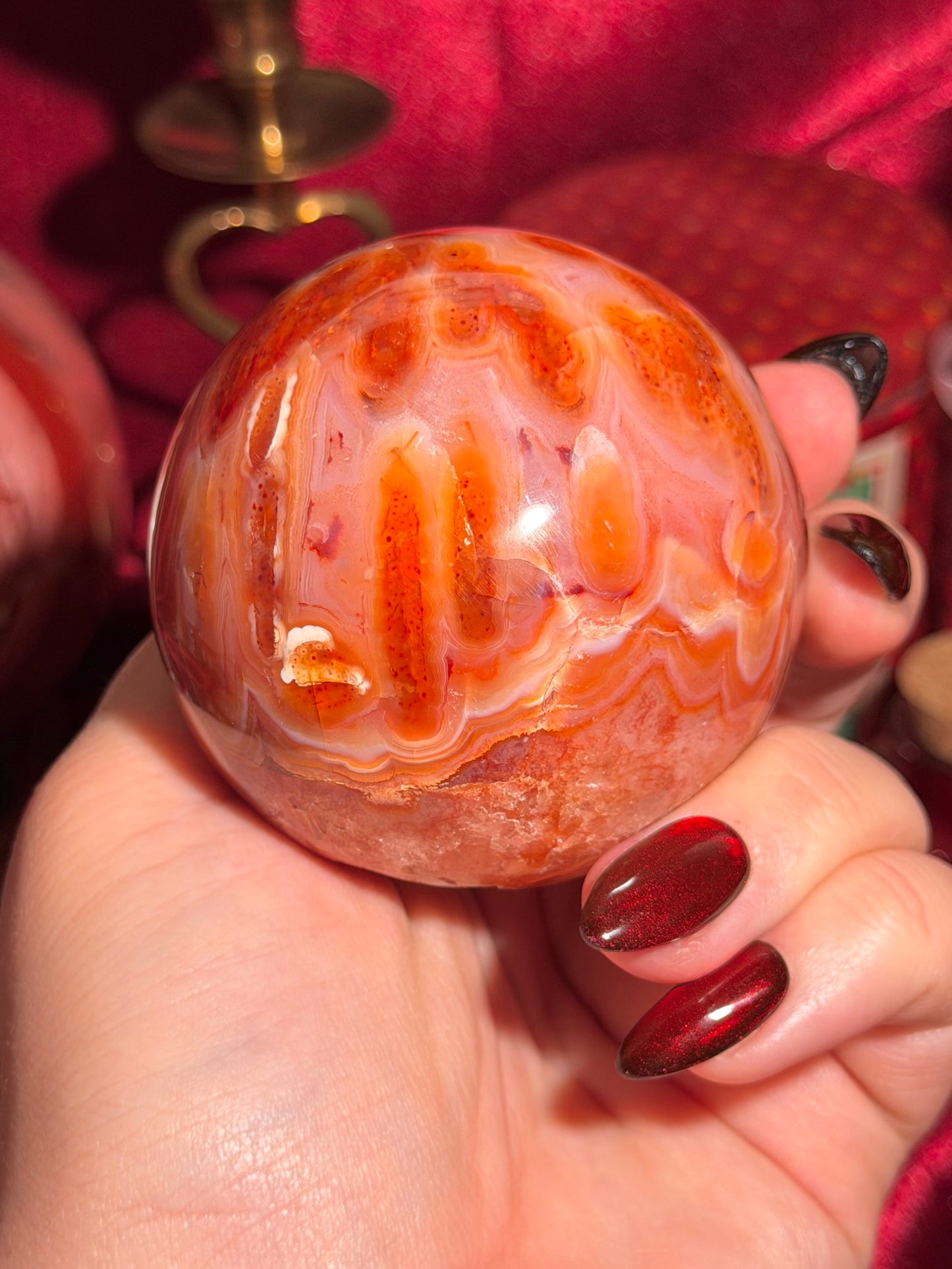 Mossy carnelian sphere with quartz cave