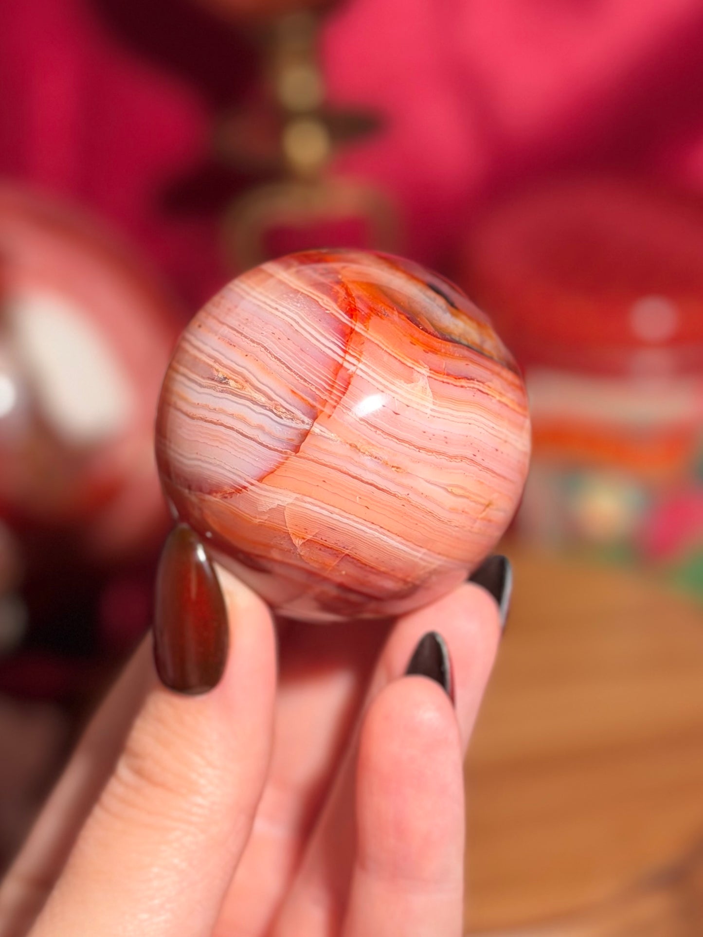 Pink banded carnelian sphere