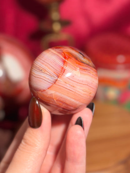 Pink banded carnelian sphere