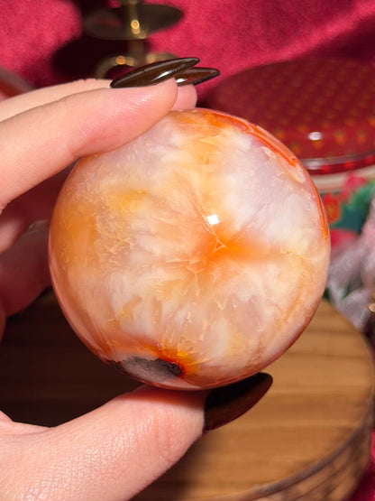 Glowy yellow carnelian sphere with imperfect fill spots