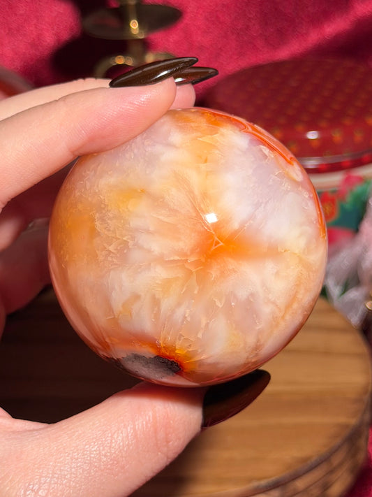Glowy yellow carnelian sphere with imperfect fill spots