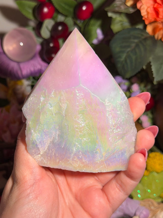 Aura coated rose quartz half polished point from Brazil