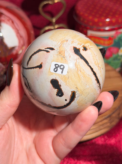 Pink and yellow Chinese picture jasper sphere with unique patterns