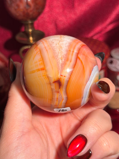 Rainbow banded carnelian sphere 65mm