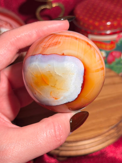 Rainbow banded carnelian sphere 65mm