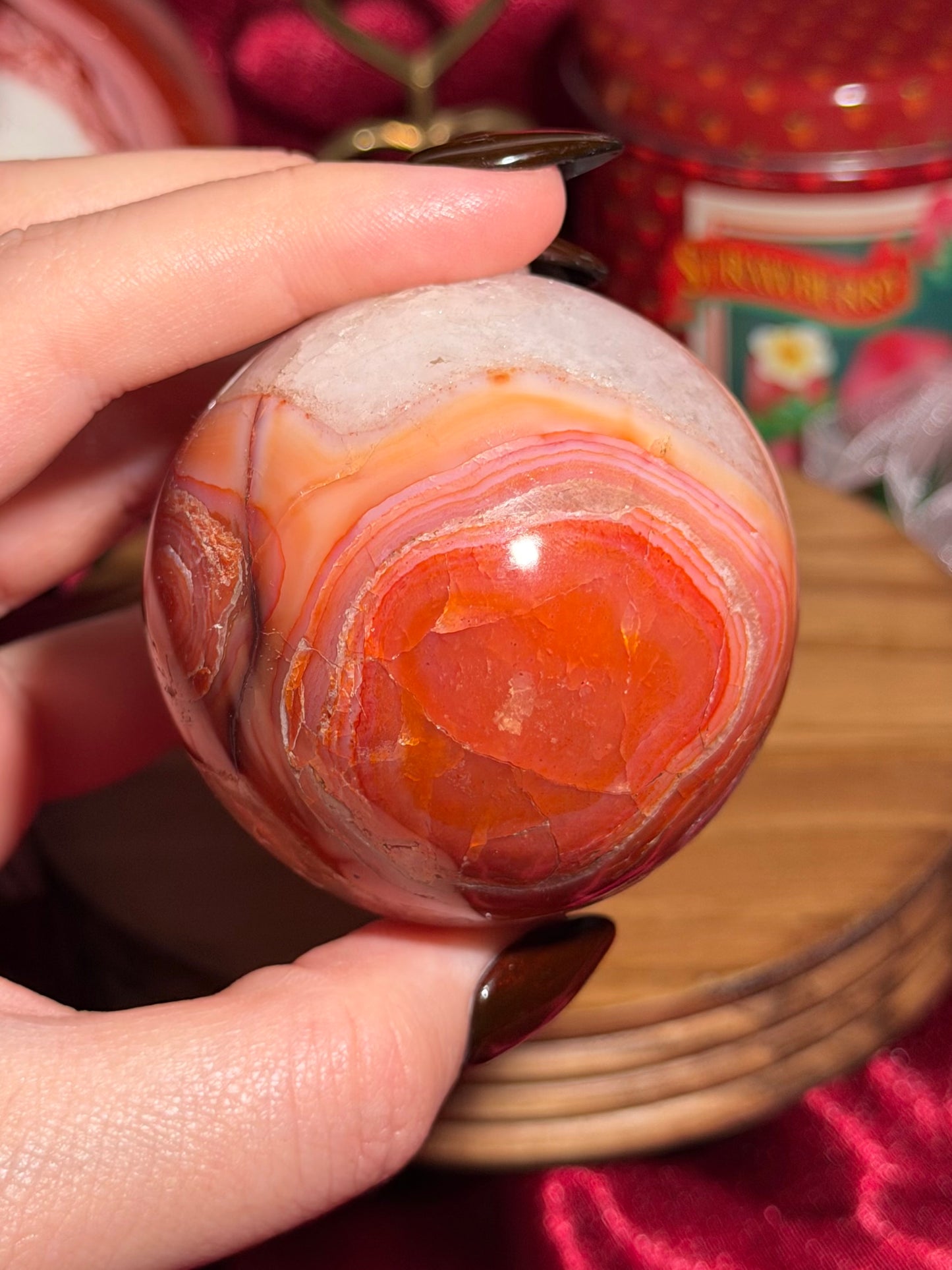 Rainbow carnelian sphere with quartz