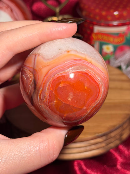 Rainbow carnelian sphere with quartz