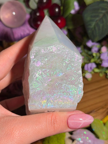 Aura coated rose quartz half polished point from Brazil