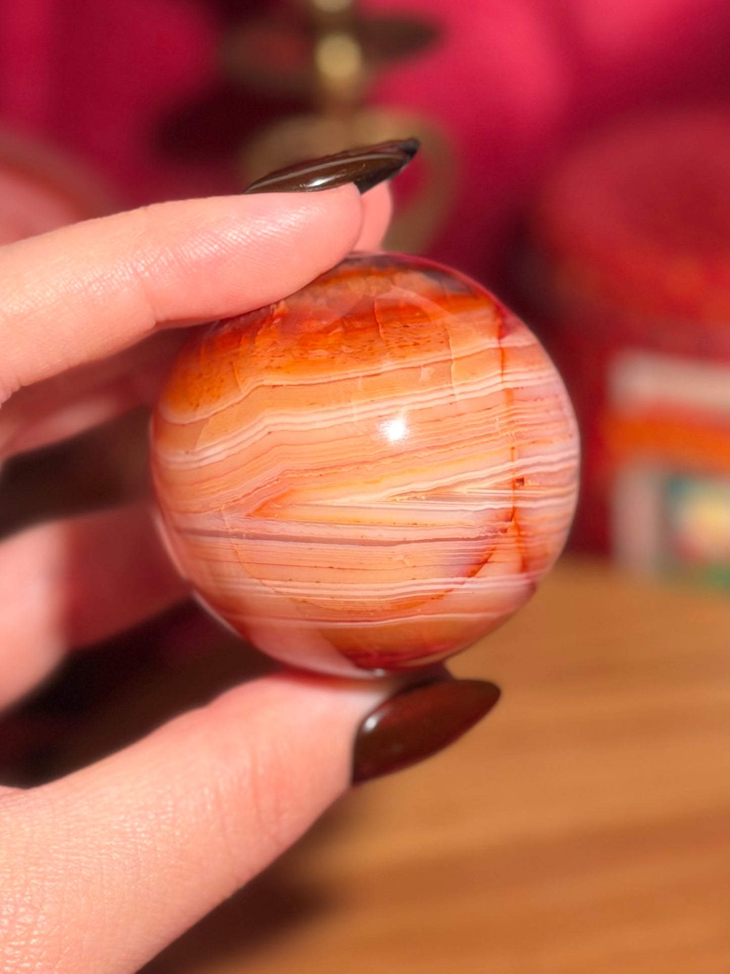 Pink banded carnelian sphere