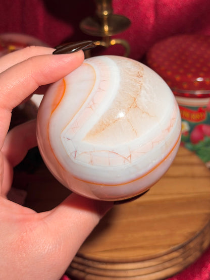 Pastel cool toned pink carnelian sphere with quartz 75mm