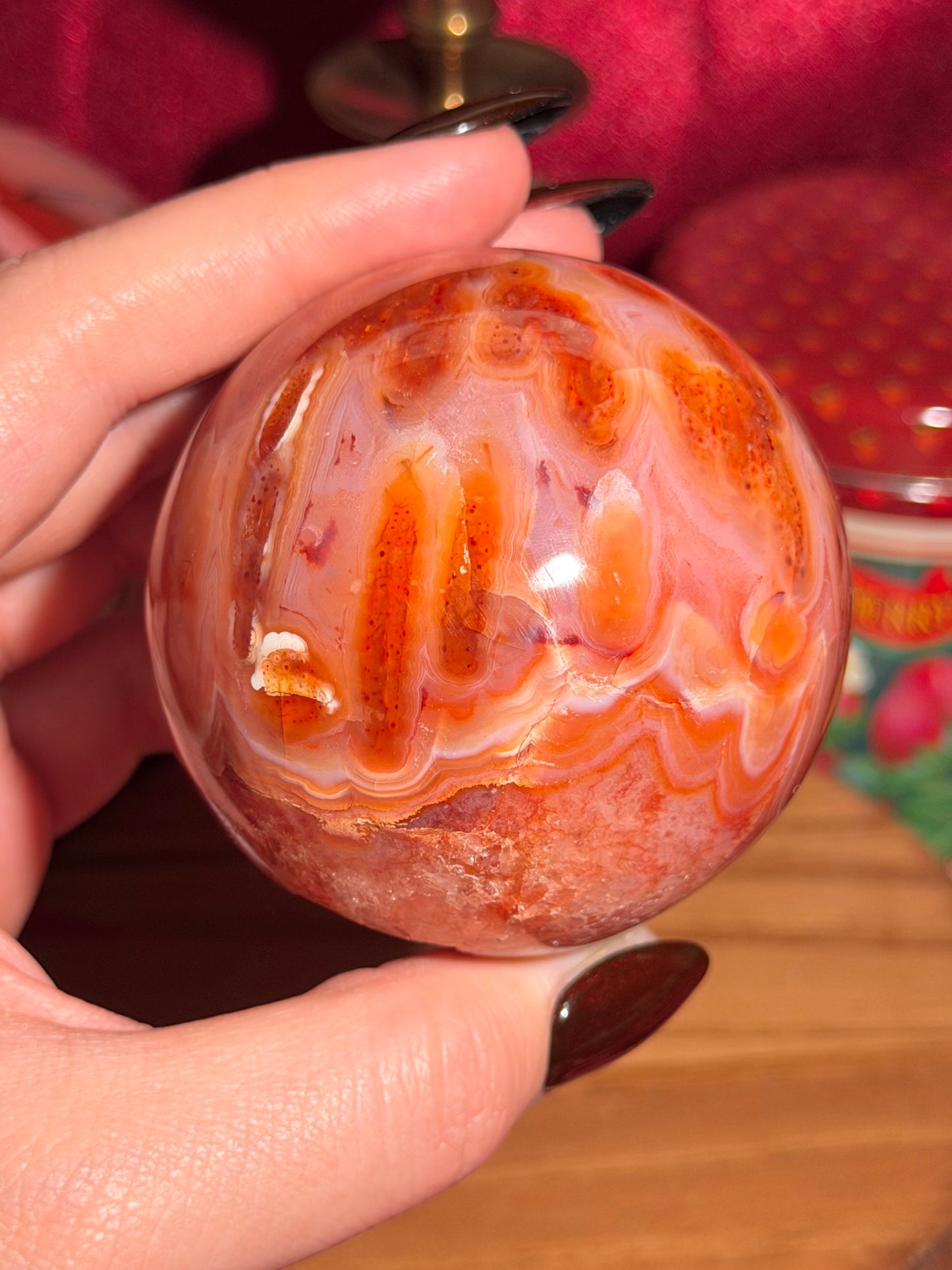 Mossy carnelian sphere with quartz cave