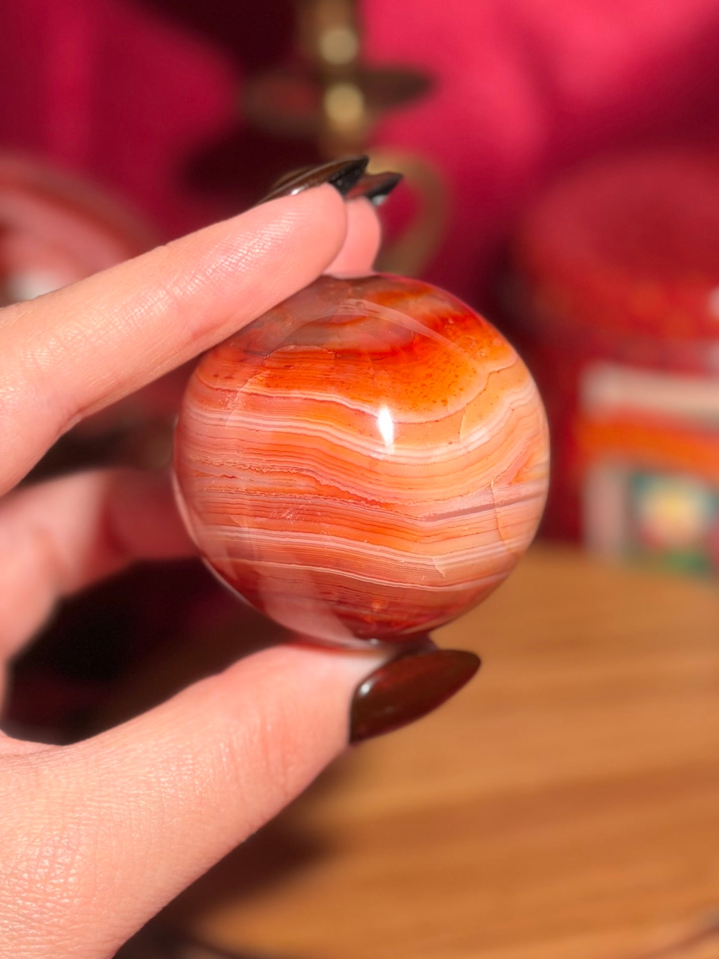 Pink banded carnelian sphere