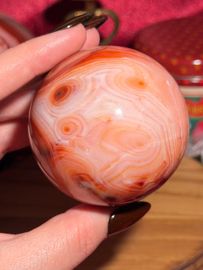 Pink banded carnelian sphere