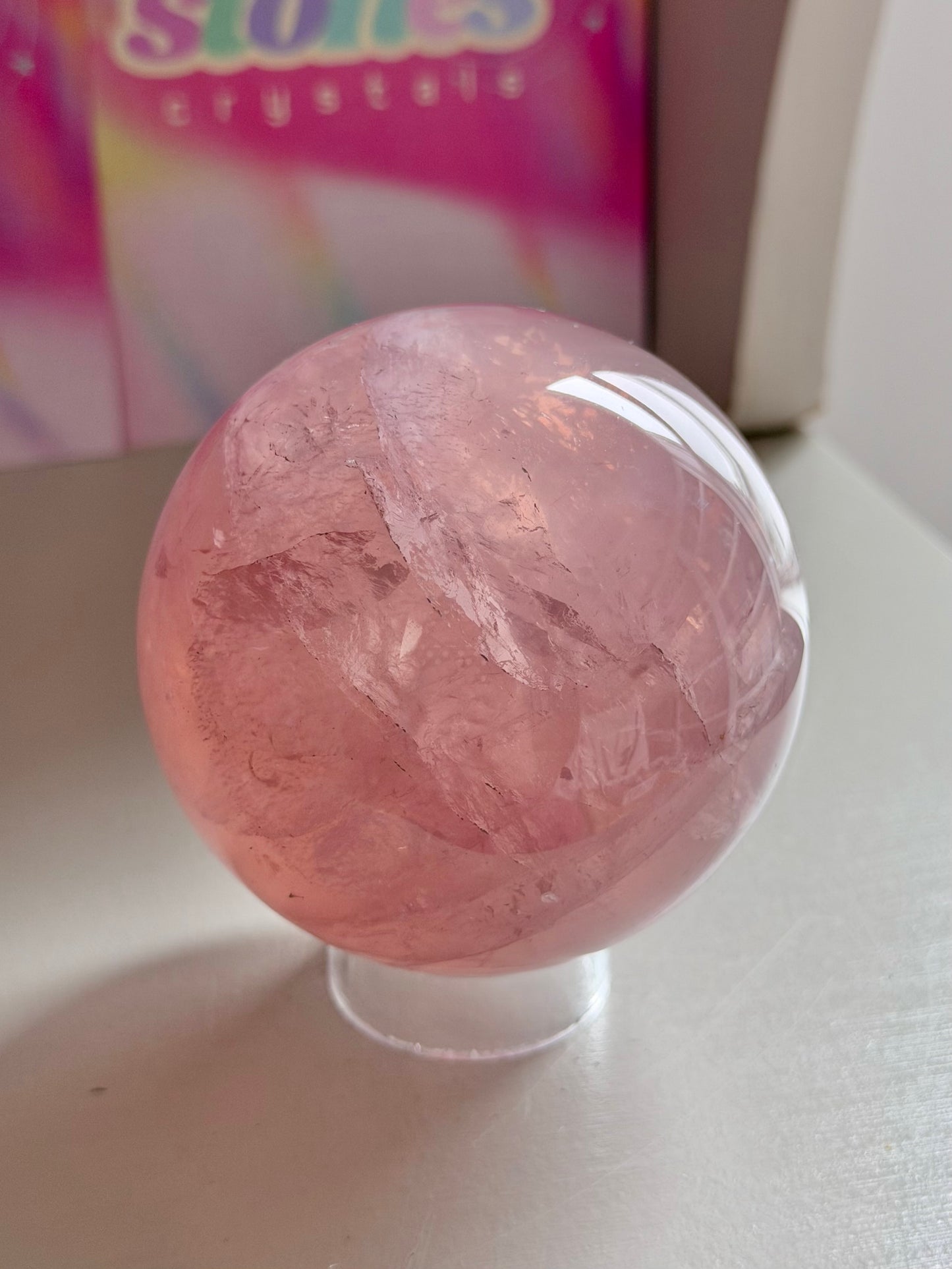 Gemmy purple-pink toned star rose quartz sphere