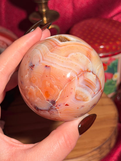 Pastel yellow and peachy toned carnelian sphere with large druzy cave 72mm