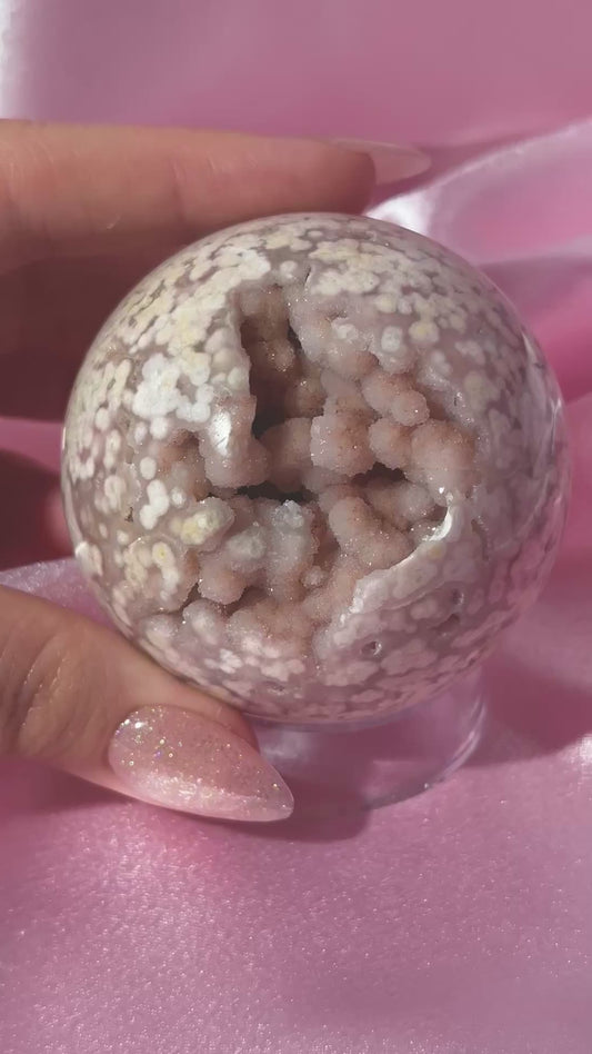 Pink pastel flower agate sphere from Madagascar with bubby druzy