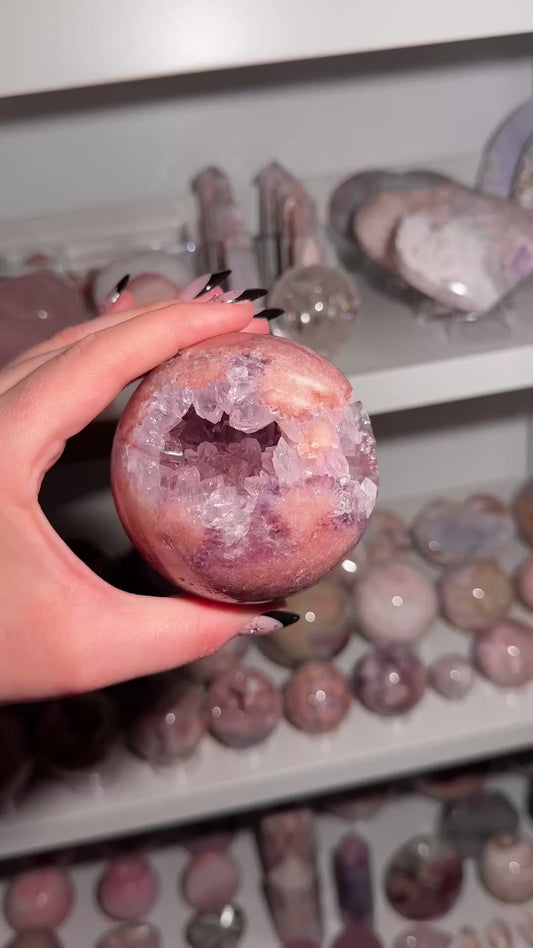 Brazilian pink amethyst x flower agate sphere with purple quartz-filled druzy cave