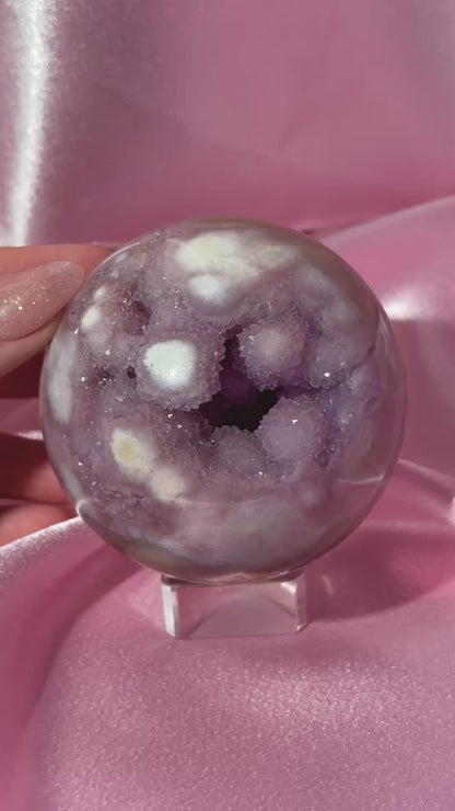 Brazilian pink amethyst x flower agate sphere with druzy cave