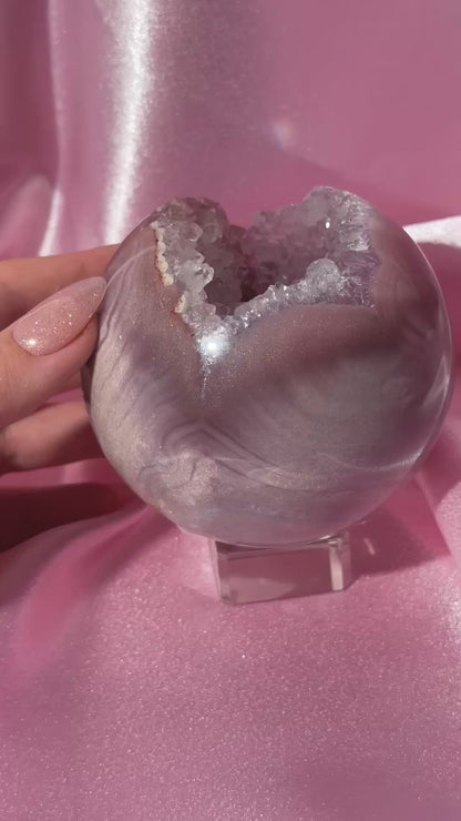 Lavender-toned glittery Brazilian pink amethyst sphere with stunning quartz cave
