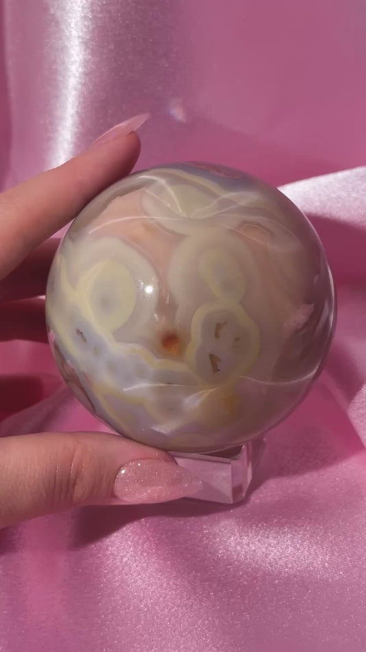 Perfect pastel peachy yellow & blue flower agate sphere from Madagascar