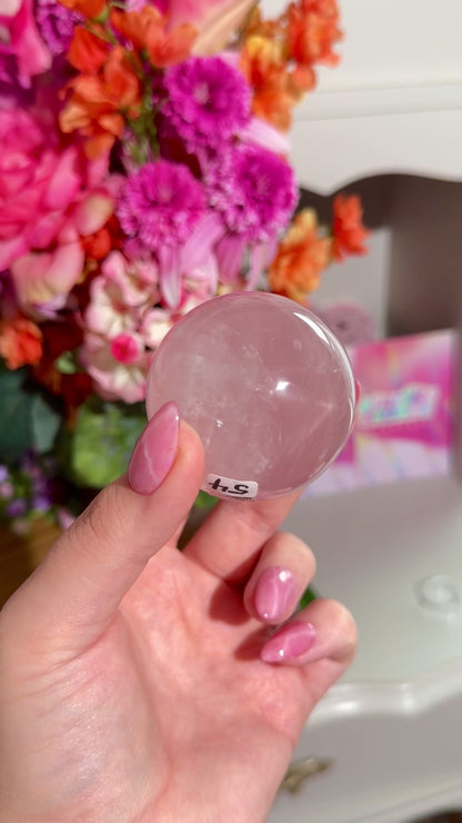 Pale pink gemmy star rose quartz sphere