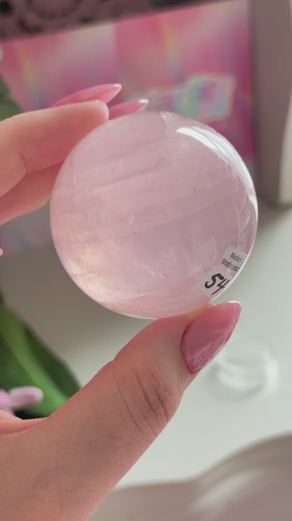Pale pink gemmy star rose quartz sphere