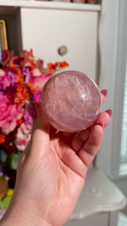 Juicy pink star rose quartz sphere with rainbows
