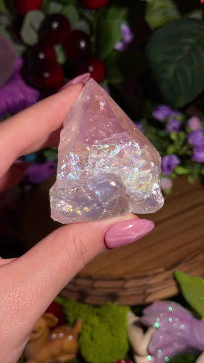 Aura coated rose quartz half polished point from Brazil
